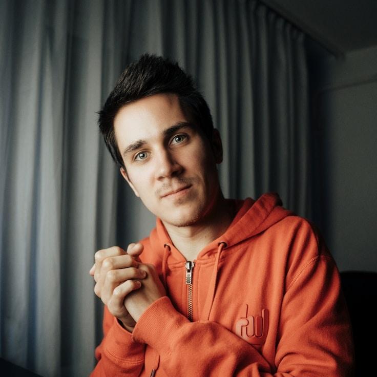 Kaveri Mehta, Lead Design Curator at ChairTimberArchive, reviewing corporate floral arrangements